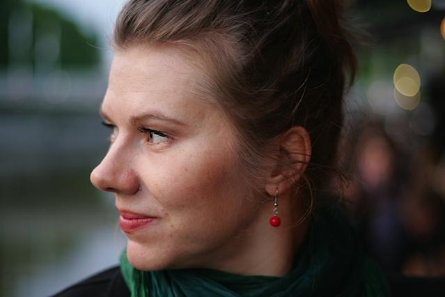 A headshot of smiling Maria Nurmela, her head is turned to the right