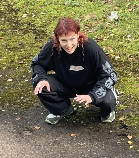 The instructor Jessica Piasecki squatting.