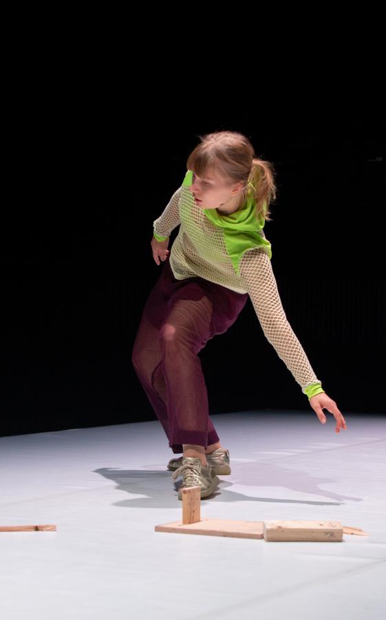 Eeva Juutinen dancing in a dark space